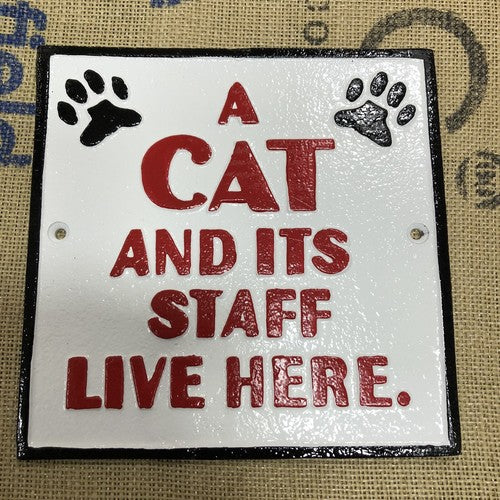A Cat And Itâs Staff Live Here Cast Iron Sign