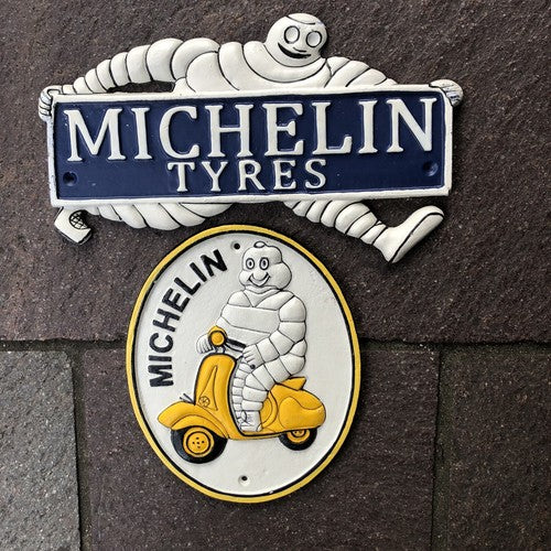 Michelin Man Two Cast Iron Signs