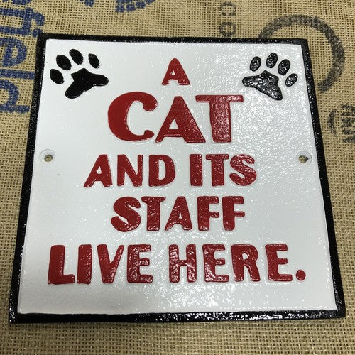 A Cat And Itâs Staff Live Here Cast Iron Sign