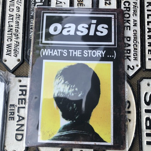 Oasis Whatâs The Story Tin Sign