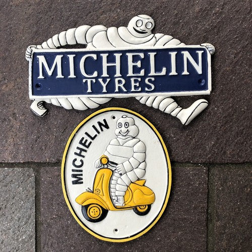 Michelin Man Two Cast Iron Signs