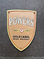 Powers Gold Label Cast Iron Sign