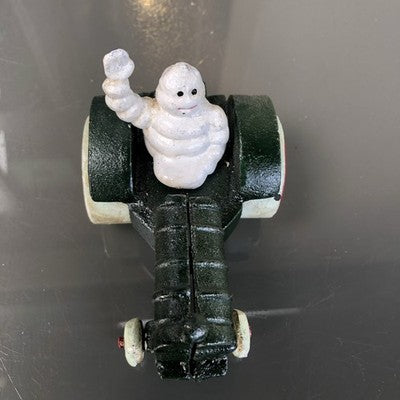Michelin Man In Tractor Cast Iron