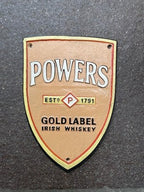 Powers Gold Label Cast Iron Sign