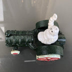 Michelin Man In Tractor Cast Iron