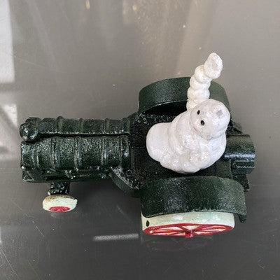 Michelin Man In Tractor Cast Iron