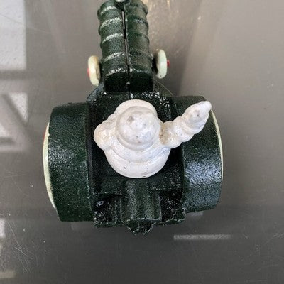 Michelin Man In Tractor Cast Iron