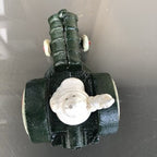 Michelin Man In Tractor Cast Iron